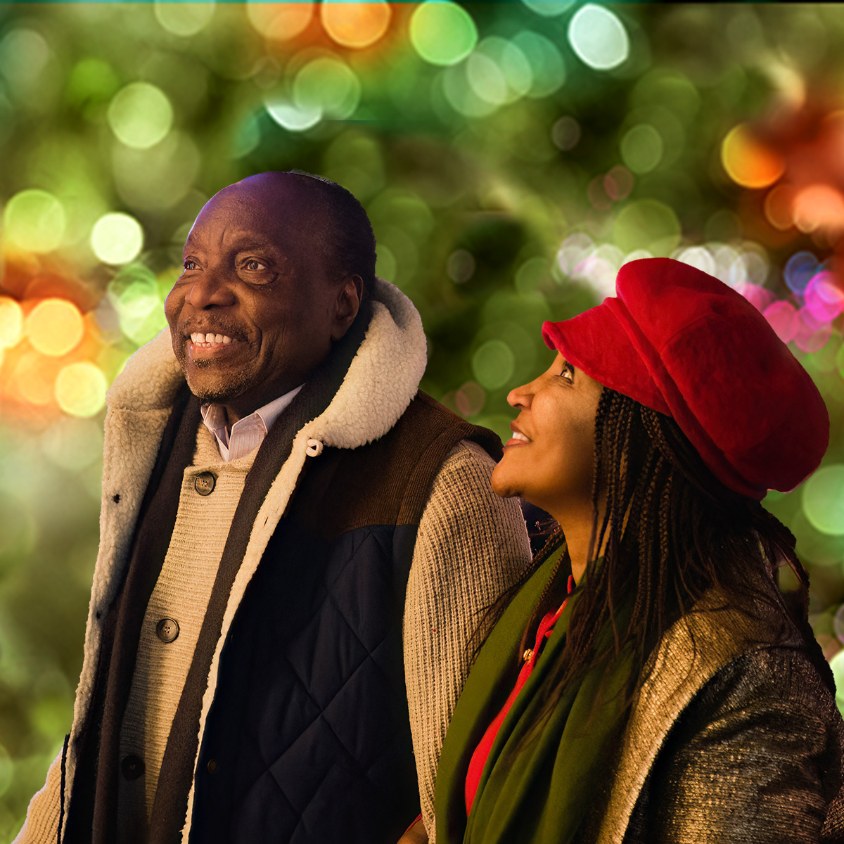 Adults surrounded by glowing green lights and warm yellow lights